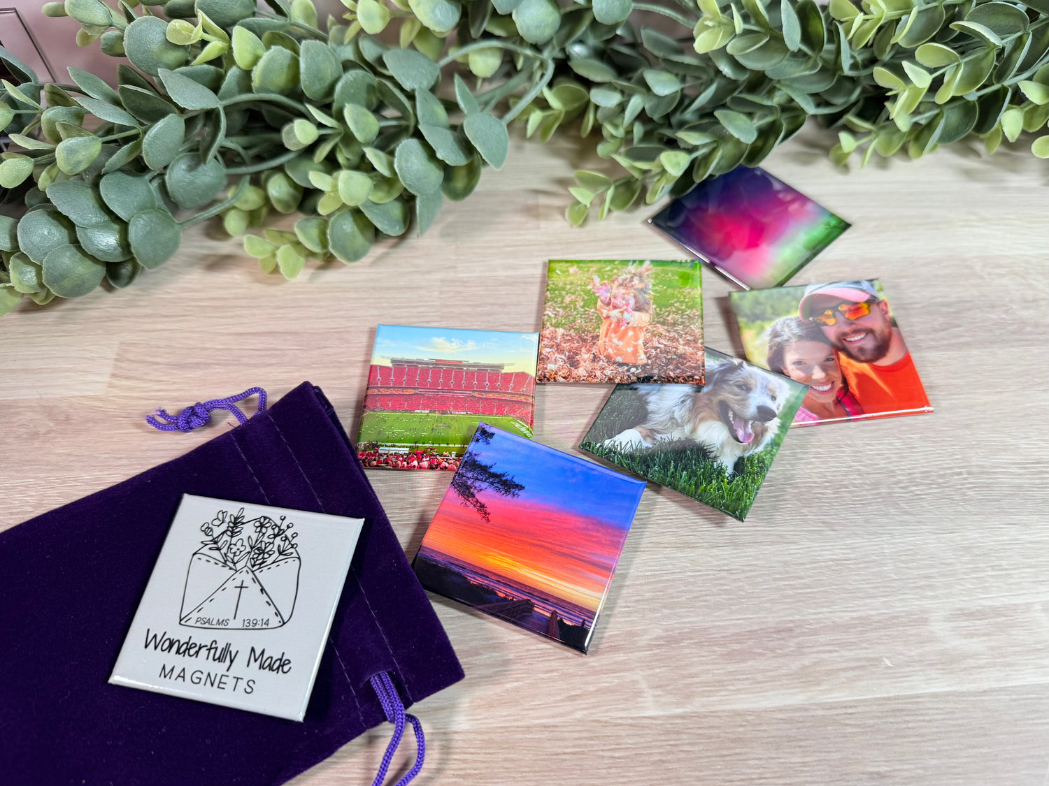 2x2 custom photo magnets featuring assorted images displayed with a cinch pouch